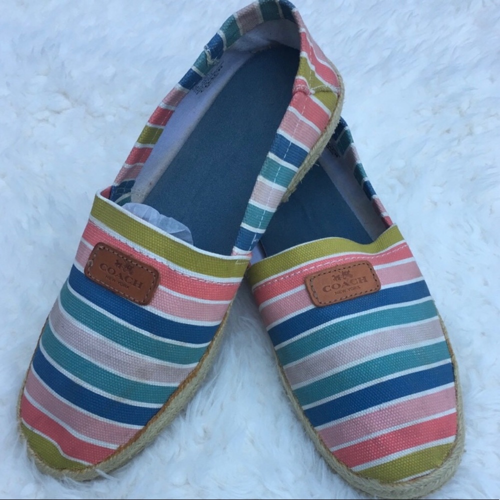 Authentic Coach slip on canvas shoes.